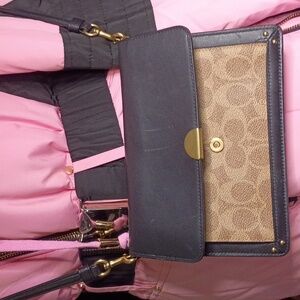 COACH Elegant Black and Tan Crossbody Bag